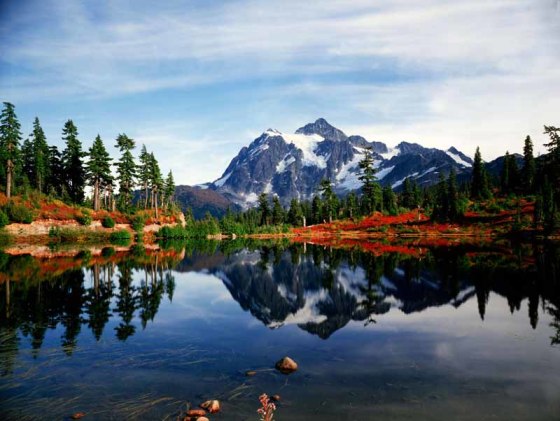 Mount Shuksan and Autumn in the Cascades National Park in Washington seen from a small mountain tarn